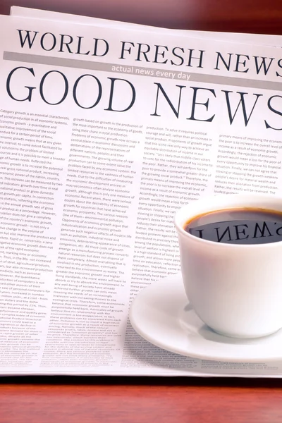Newspaper and cup of coffee — Stock Photo, Image