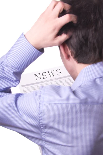 Homem lendo um jornal com inscrição NEWS — Fotografia de Stock