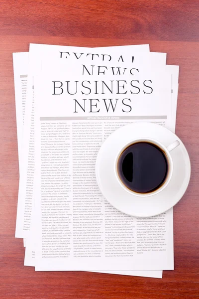 Newspaper and a cup of coffee — Stock Photo, Image