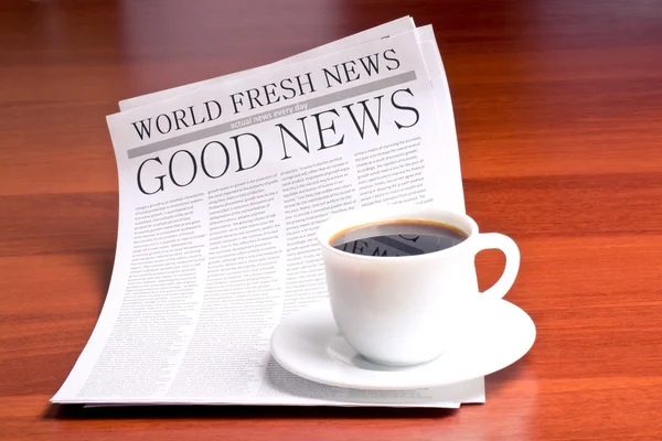 Newspaper and cup of coffee — Stock Photo, Image