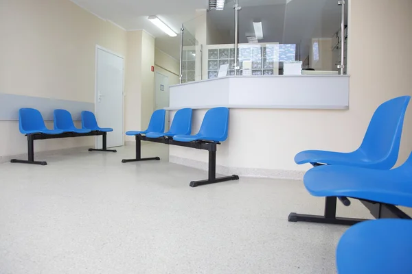 Waiting room blue chairs on the floor