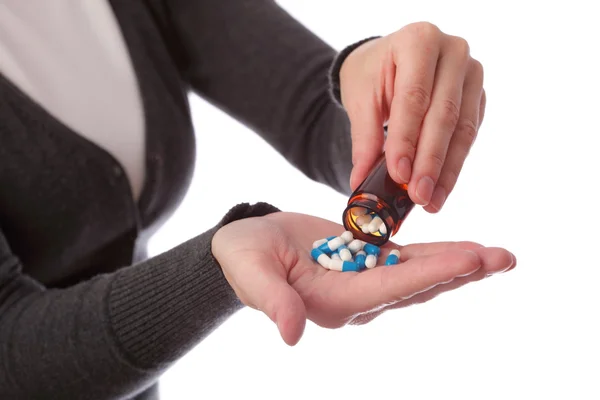 Tabletki w ręce kobiety — Zdjęcie stockowe