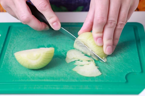 Preparing onion in the kitchen — Stock Photo, Image
