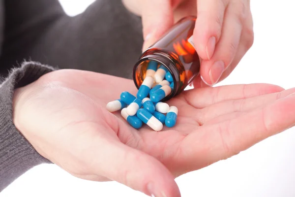 Pills in woman hand — Stock Photo, Image