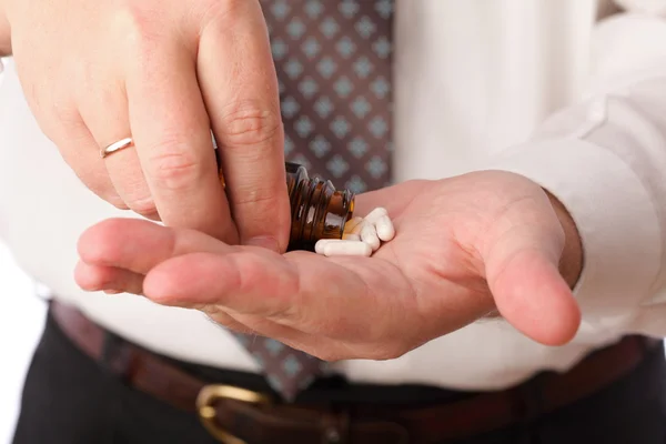 Pills in man hand — Stock Photo, Image