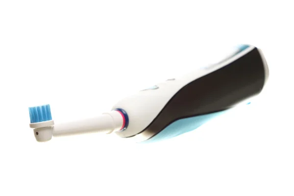 Электрическая зубная щетка изолирована на белом — стоковое фото