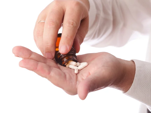 Pills in man hand — Stock Photo, Image