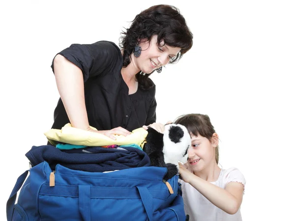 Woman and daughter hand crammed full of clothes and shoulder bag — Stock Photo, Image