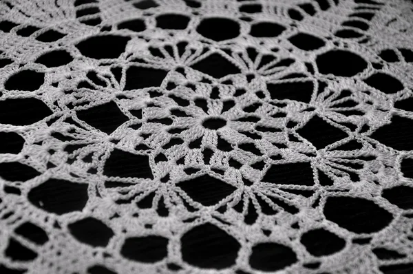 stock image White Crochet Lace on Black Background