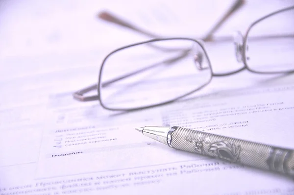 Eyeglasses and Pencil on a Documents — Stock Photo, Image