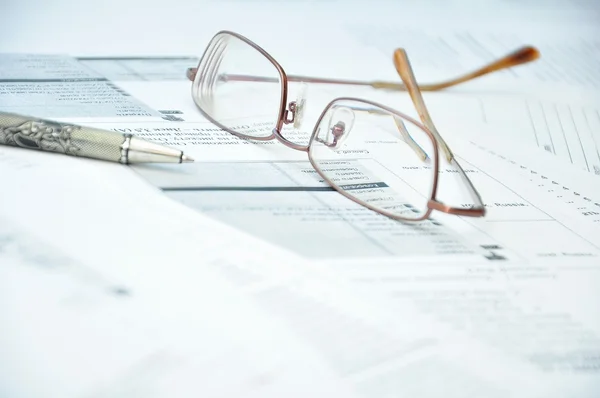 Eyeglasses and Pencil on a Documents — Stock Photo, Image