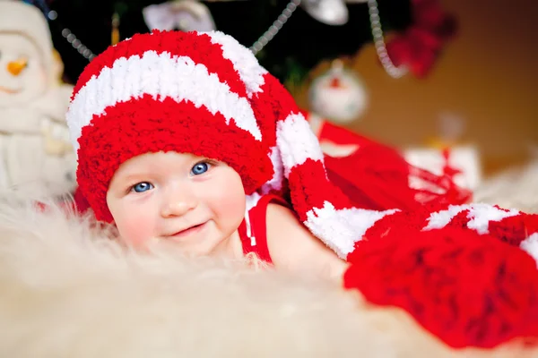 Cute little girl in the New Year bell — Stock Photo, Image
