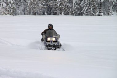 Man on a snowmobile clipart