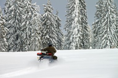 Man on a snowmobile clipart