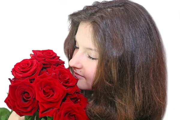 Girl enjoys the smell of roses — Stock Photo, Image