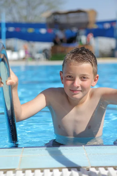 Boy in pool — Stock Photo, Image