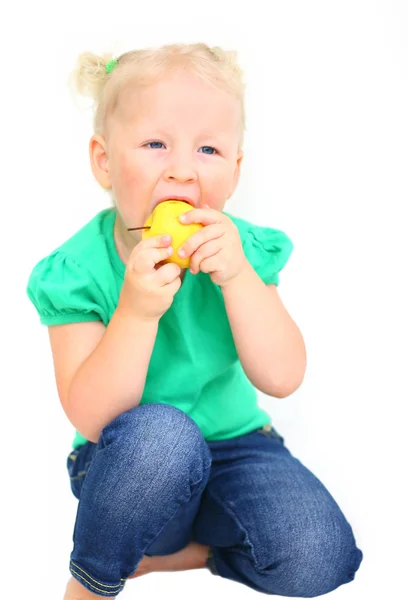 Child with an appetite for eating an apple — Stock Photo, Image
