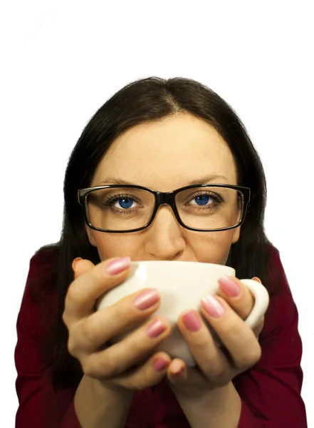 Brunette with a hot cup of coffee — Stock Photo, Image