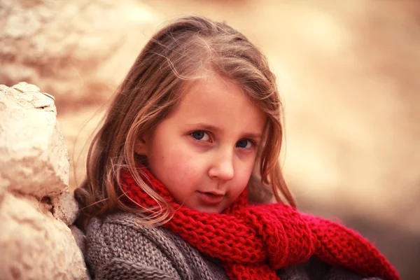 Child in a red scarf — Stock Photo, Image