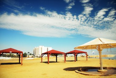 Beautiful beach with awnings clipart