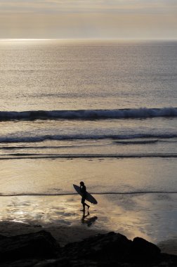 Surfer Sunset Silhouette, Cornwall, UK. clipart