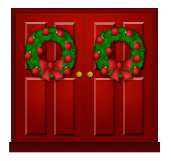 Красная дверь с рождественским венком — стоковое фото