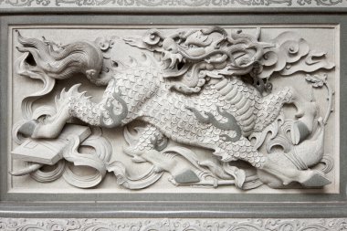 Stone Carving of Qilin on Chinese Temple Wall clipart
