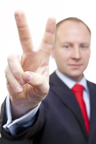 Peace sign by businessman — Stock Photo, Image