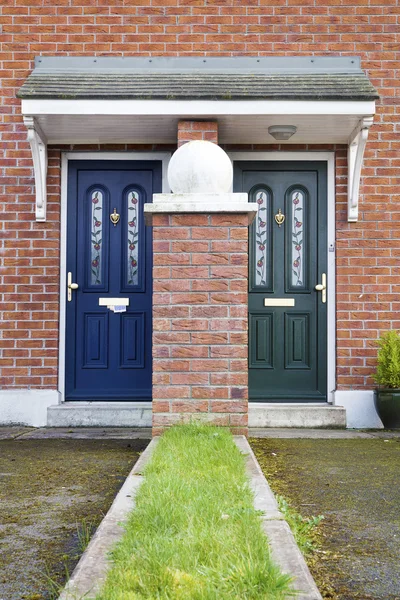 Similar but different entrance door — Stock Photo, Image