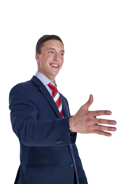 Lachende zakenman biedt een hand — Stockfoto