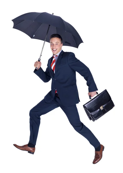 Smiling businessman running — Stock Photo, Image