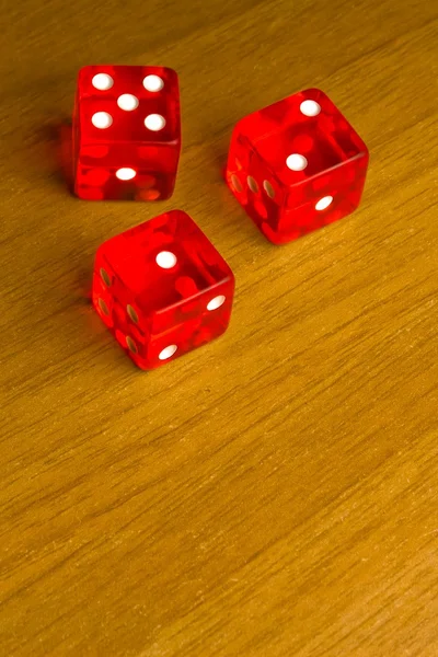 Red dice on old wood desk — Zdjęcie stockowe