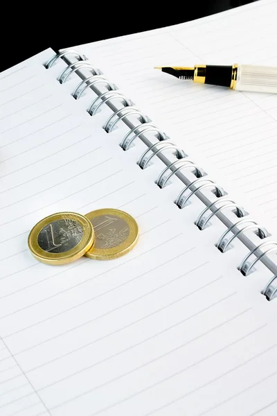 Euro coin business on notepad — Stock Photo, Image