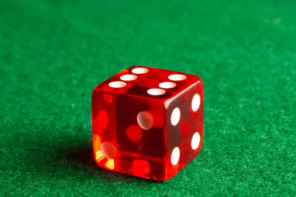 One dice on gaming table — Stock Photo, Image