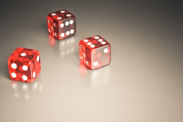 Red dice on a smooth surface — Stock Photo, Image