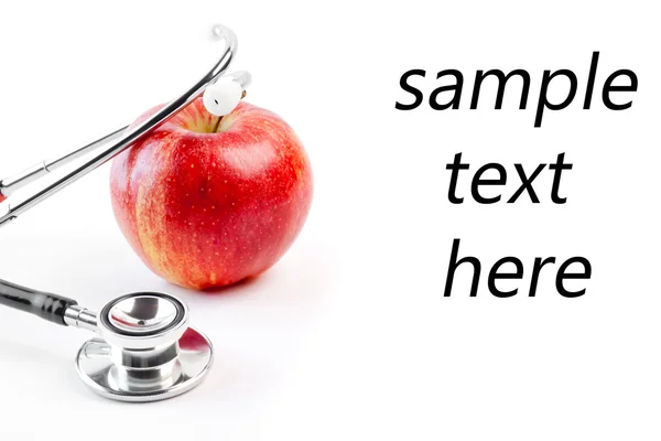Stetoscopio medico su mela rossa — Foto Stock