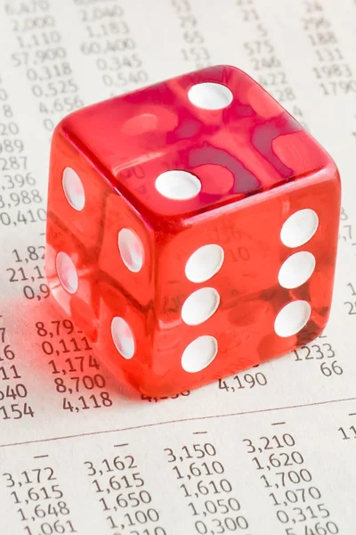 One red dice on the financial newspaper — Stock Photo, Image