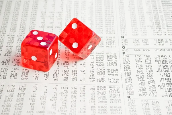 Two red dice on the financial newspaper — Stock Photo, Image
