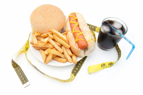 Fast food burger with tape measure — Stock Photo, Image