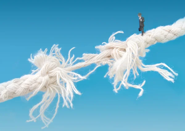 Businessman walking tightrope — Stock Photo, Image