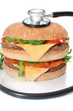 Unhealthy burger with stethoscope clipart