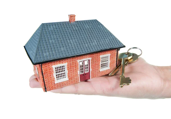 Casa y llaves en una mano — Foto de Stock
