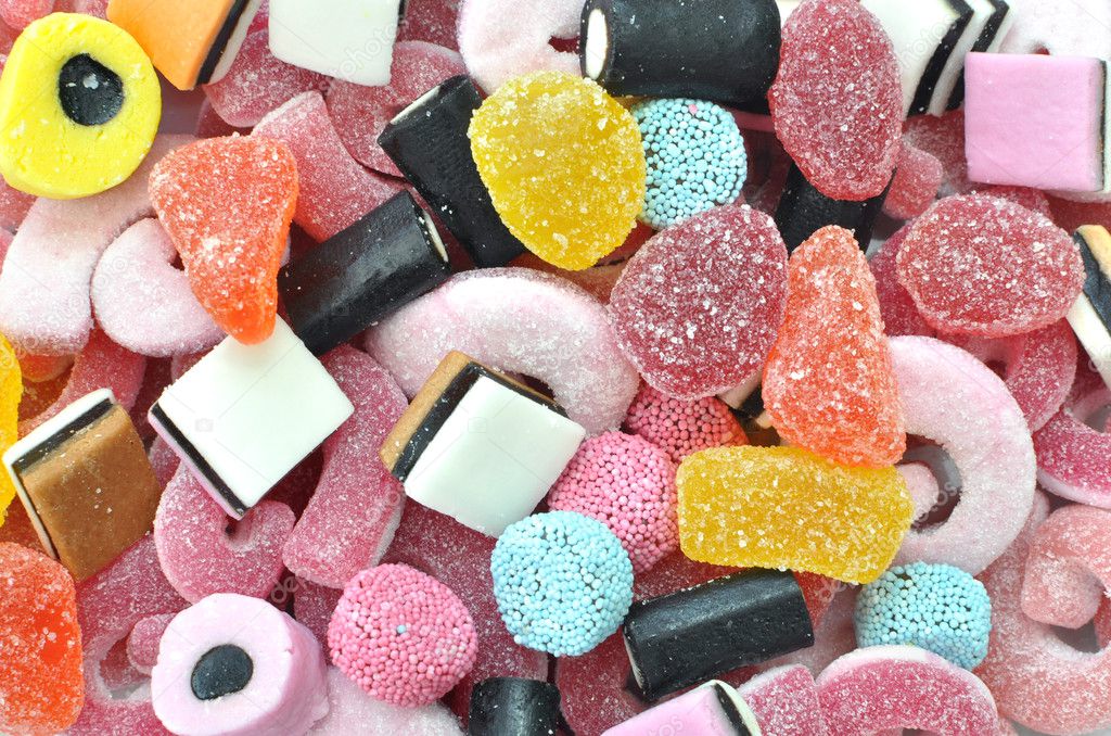 Download - Sugar coated coloured sweets background - Stock Image. 