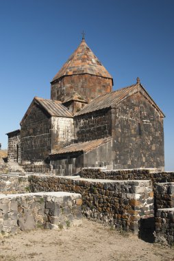 Ancient armenian church on lake sevan armenia clipart