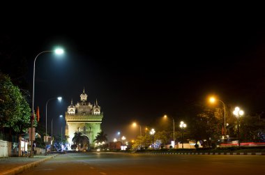 Patuxai arch at night in vientiane, laos clipart