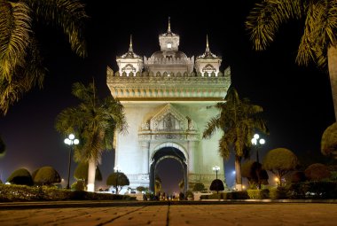 Patuxai arch at night in vientiane, laos clipart