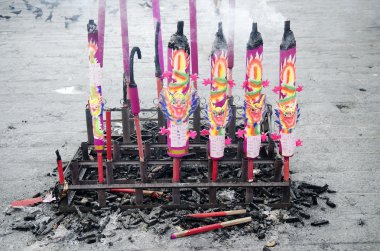 Incense burning in chinese temple in malaysia clipart