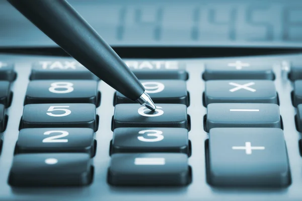 Calculator with pen — Stock Photo, Image