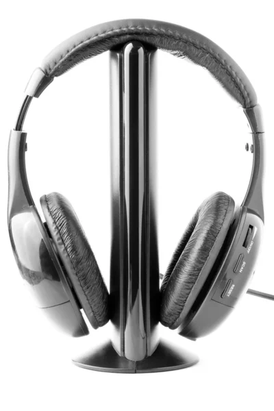 Black headphones on the stand — Stock Photo, Image
