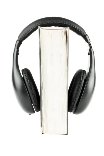 Kulaklık ile bir kitap — Stok fotoğraf